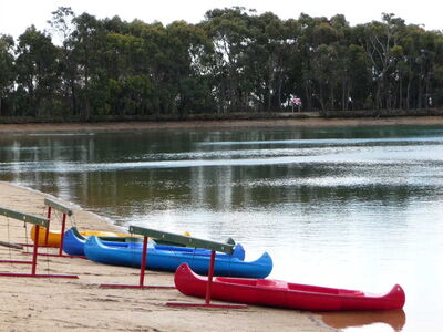 Kayaks_by_the_lake.JPG