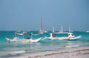 Boats_docked_by_the_beach.JPG